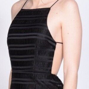 Sleek black high neck line with open back dress